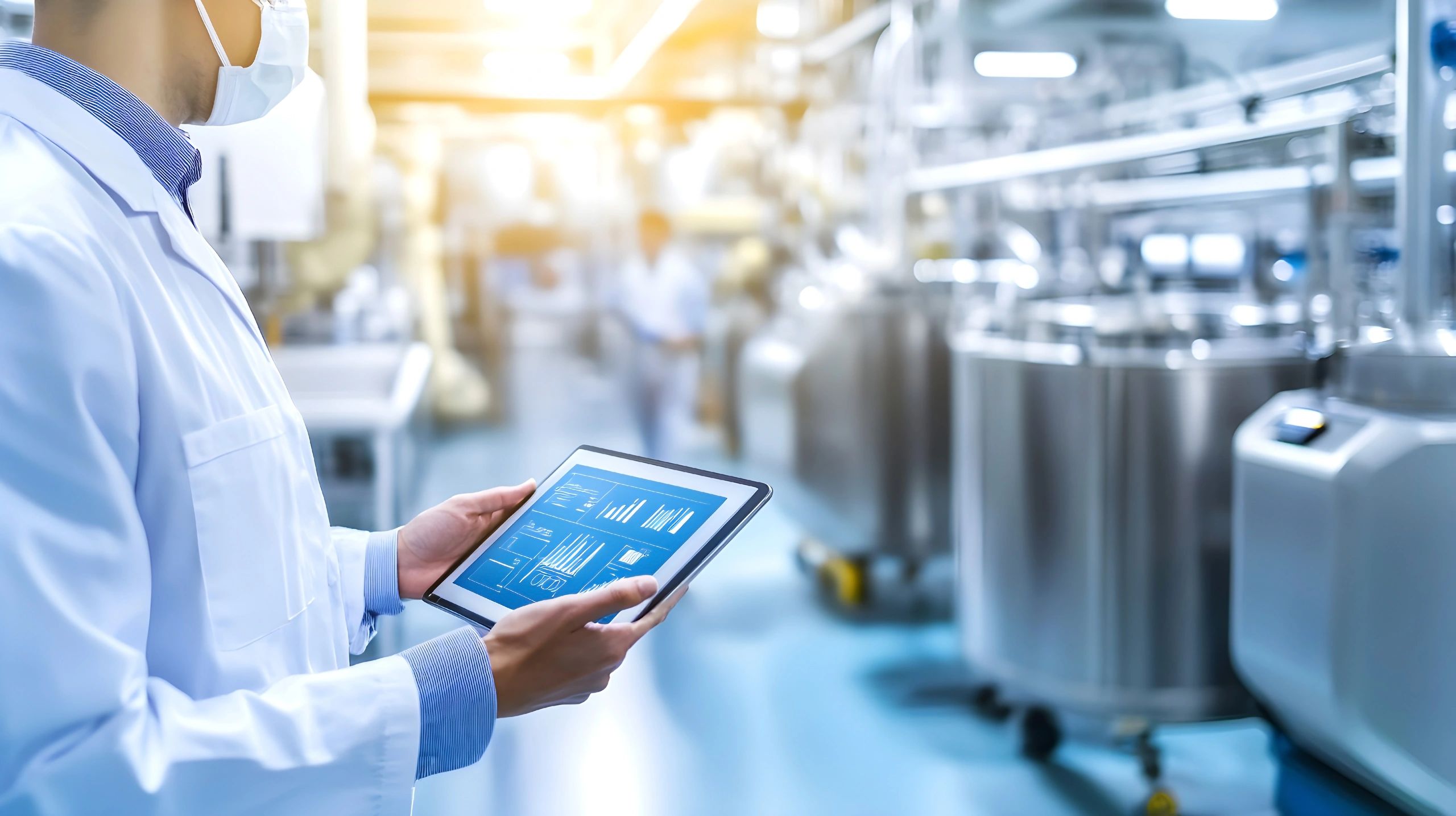 Professional reviewing data analytics in a modern industrial facility